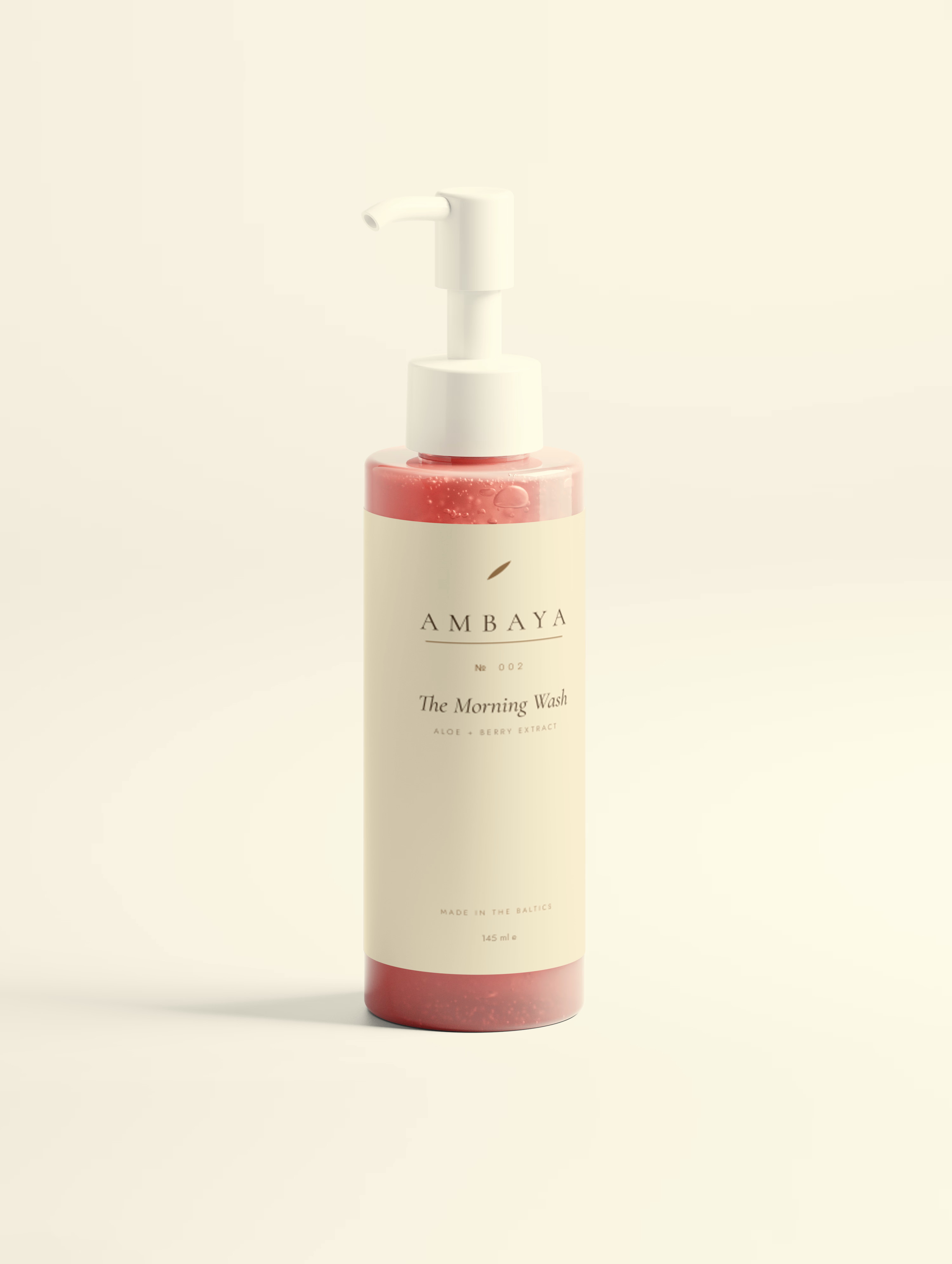 Pump bottle of The Morning Wash, 145 ml, with a cream label and the gold AMBAYA wordmark, on a pale cream background.