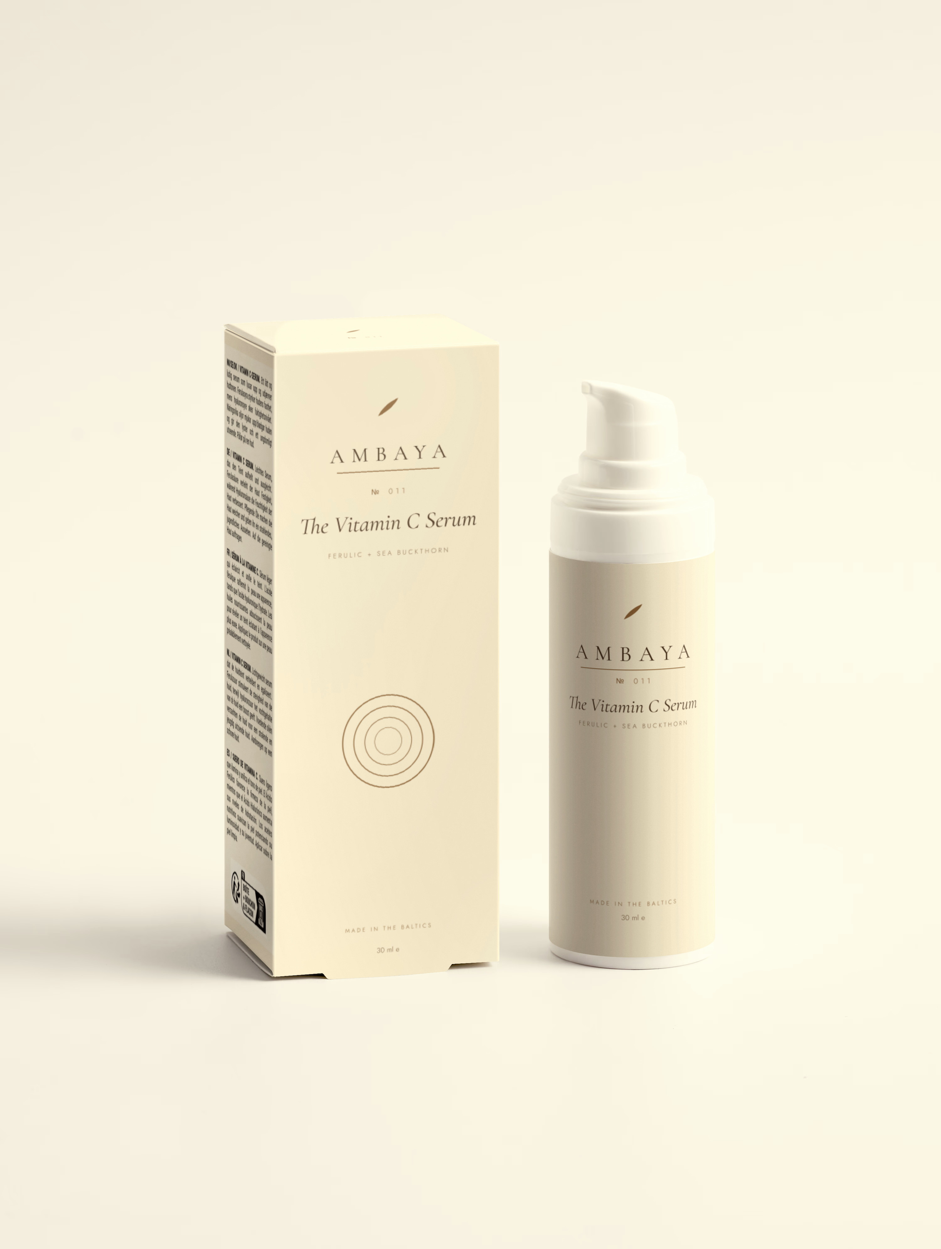 Cream carton and airless pump bottle of The Vitamin C Serum, 30 ml, with the gold AMBAYA wordmark and leaf mark, on a pale cream background.